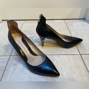 Carolinna Espinosa black leather shoes with zebra heels.